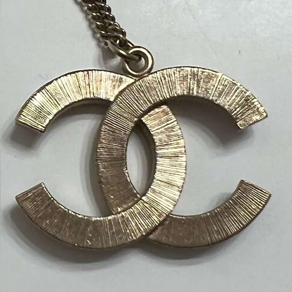 Chanel gold and black pearl CC pendant necklace, Authentic